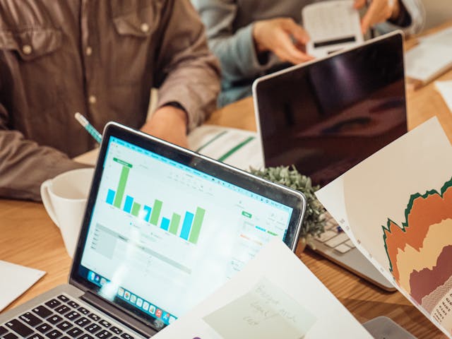 Business owner comparing website pricing options and long term value